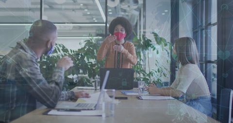 Team Collaborating on Innovative Business Solutions Using Technology