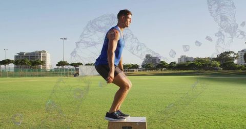 Athlete performing plyometric box jump on grass with earbuds and digital wireframe overlay