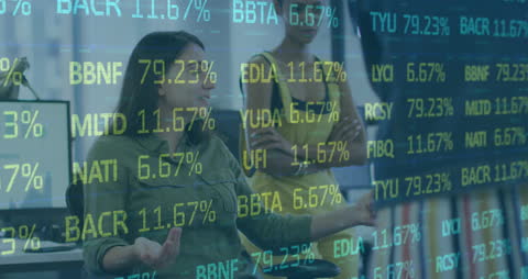 Diverse Women Collaborating in Modern Office with Stock Market Hologram