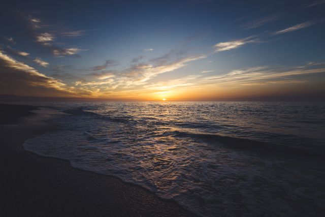 Calm Ocean Sunset with Golden Clouds - Download Free Stock Photos Pikwizard.com