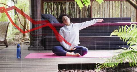 Woman practicing side stretch on porch yoga mat with calming greenery and graph overlay
