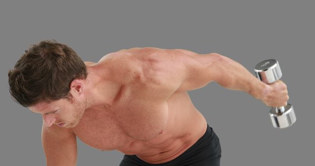 Fit Man Exercising with Dumbbell on Grey Background - Download Free Stock Images Pikwizard.com