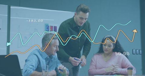 Diverse business team analyzing financial data trends at office meeting