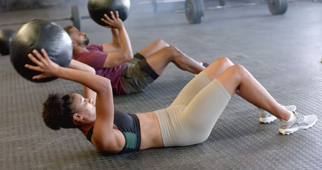 Fit Athletes Performing Medicine Ball Exercises in Gym - Download Free Stock Images Pikwizard.com