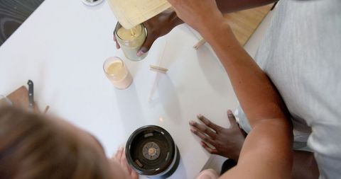 Diverse Couple Preparing Nutritious Smoothie Together at Home