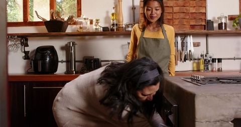 Mother and Daughter Enjoy Moments in Rustic Kitchen