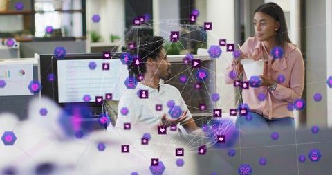 Colleagues collaborating in open office discussing ideas with purple network overlay