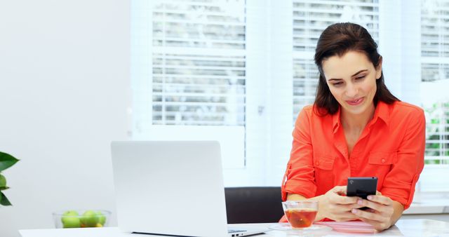 Woman Working from Home on Smartphone and Laptop - Download Free Stock Images Pikwizard.com