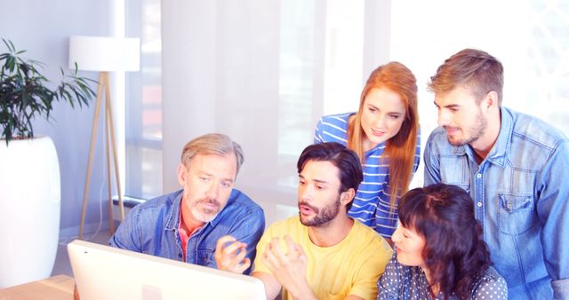 Collaborative Team Having Productive Meeting Around Computer - Download Free Stock Images Pikwizard.com