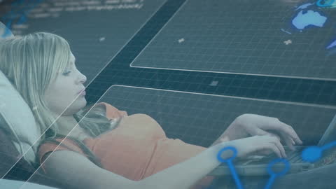 Woman Using Laptop Overlaid with Digital Data Graphics