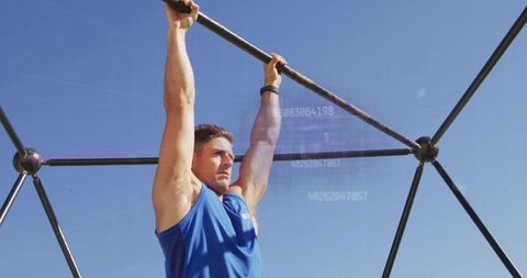 Athlete Hanging on Outdoor Rig with Data Overlay