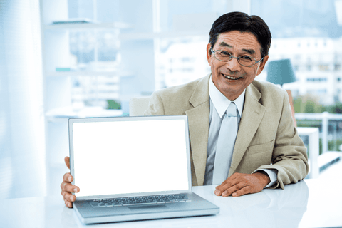 Smiling Asian Businessman with Transparent Laptop Screen - Download Free Stock Videos Pikwizard.com