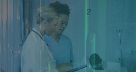 Healthcare Professionals Collaborating in Hospital Room with Patient Nearby