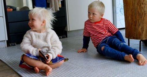 Siblings Enjoying Quality Time at Home