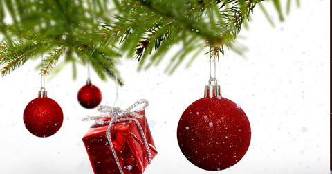 Red Ornaments and Gift Box Hanging on Christmas Tree with Snowflakes - Download Free Stock Images Pikwizard.com
