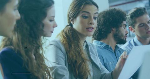 Productive Business Team Collaborating in Modern Office Setting