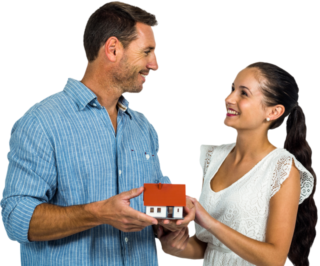 Smiling Couple Holding House Model Isolated on Transparent Background - Download Free Stock Videos Pikwizard.com