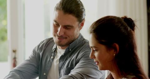 Enthusiastic couple discussing wedding plans together