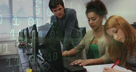 Students Collaborating on Coding Project in Computer Lab with Binary Overlay and Monitors