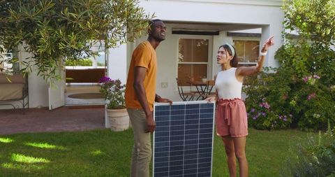 Eco-Friendly Couple Planning Solar Panel Installation at Home