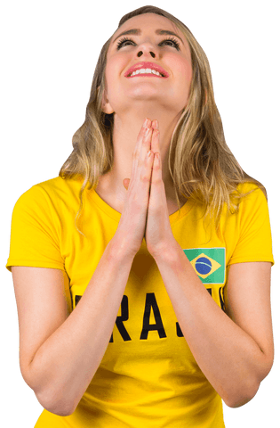 Transparent football fan in brasil t-shirt celebrating victory