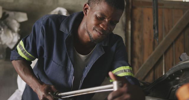 Mechanic Working on Car with Wrench in Hand - Download Free Stock Images Pikwizard.com