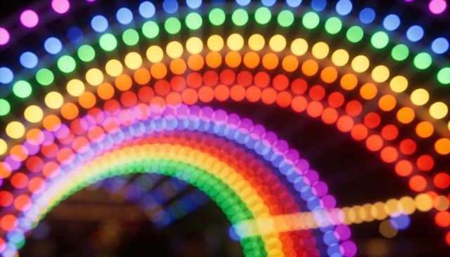 Glowing bokeh rainbow arches led tunnel creating vibrant abstract festival light backdrop
