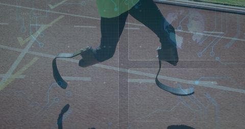Paralympic athlete running with prosthetic legs on track