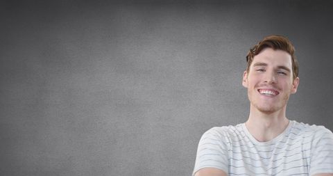 Happy Young Man Laughing with Gray Background Portrait - Download Free Stock Images Pikwizard.com