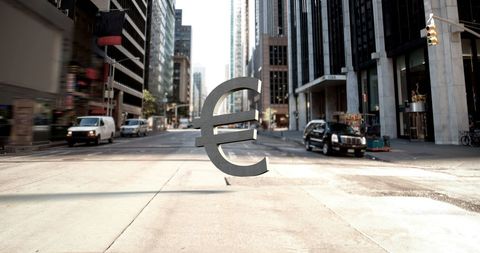 Euro Symbol Floating in Urban Financial District