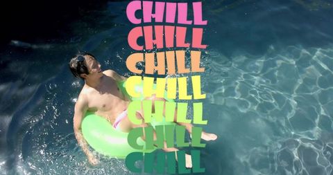 Man relaxing on green pool float in sunlit blue water with colorful chill text