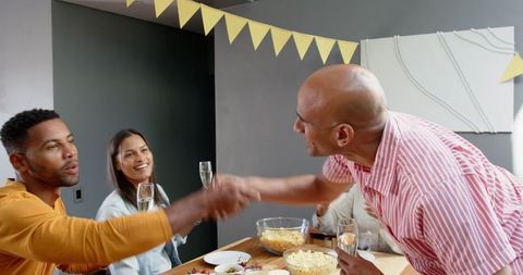 Diverse Friends Toasting at Birthday Celebration Gathering