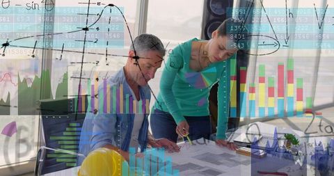 Architects collaborating over blueprints with data visualizations and construction planning
