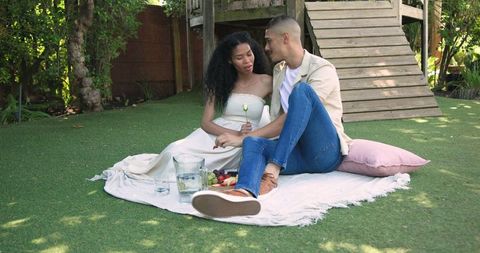 Romantic Couple Enjoying Outdoor Picnic on Garden Lawn