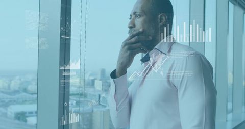 Businessman Analyzing Digital Investments with Graphs