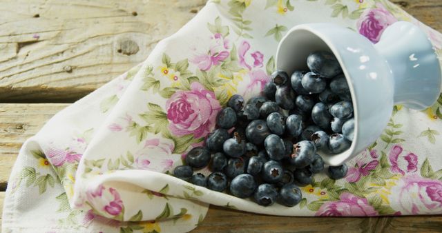 Fresh Blueberries Spilled on Floral Napkin - Download Free Stock Images Pikwizard.com