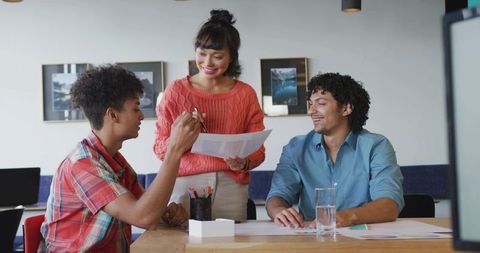 Creative Team Collaboratively Brainstorming in Modern Office