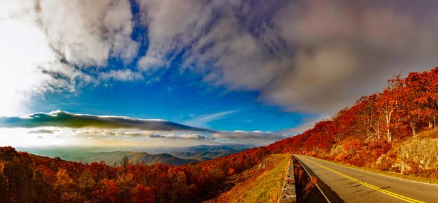 Scenic View of Mountain Road Against Cloudy Sky - Download Free Stock Photos Pikwizard.com