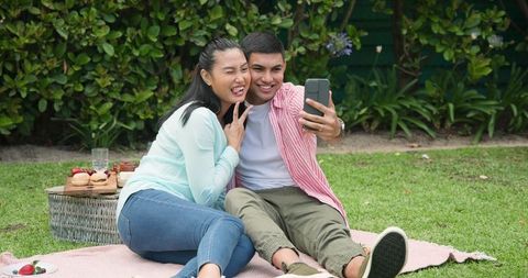Happy Couple Taking Selfie During Outdoor Picnic