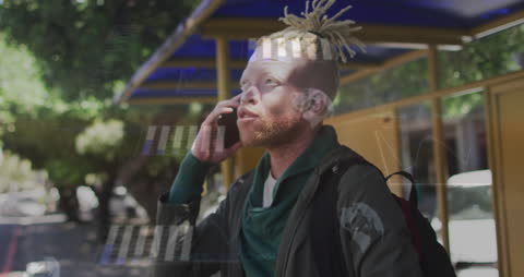 Businessman Talking on Cellphone with Virtual Graphics Overlay