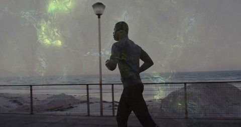 Determined Runner on Seaside Promenade at Dawn