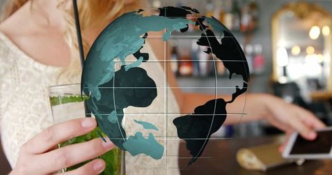 Translucent globe overlay with woman at bar holding drink