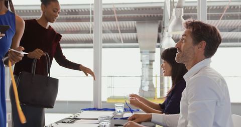 Diverse Team Collaborating in Meeting Room