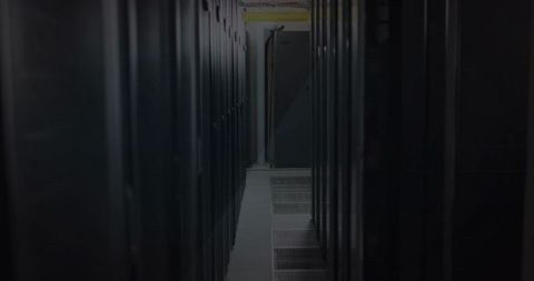 Framing narrow data center aisle with raised floor, server racks and overhead cables