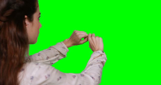 Woman Pointing at Empty Green Screen Background - Download Free Stock Images Pikwizard.com