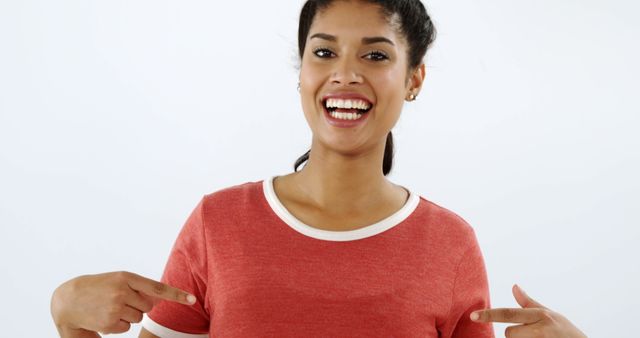 Smiling Woman Pointing at Blank Red T-Shirt - Download Free Stock Images Pikwizard.com