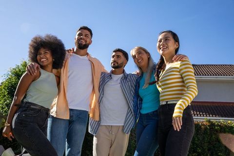 Diverse Friends Gather in Cheerful Unity Outdoors
