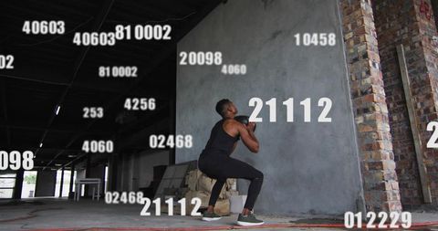 Man Exercising with Kettlebell in Industrial Warehouse Interior