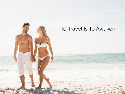 Happy couple walking on sunny beach