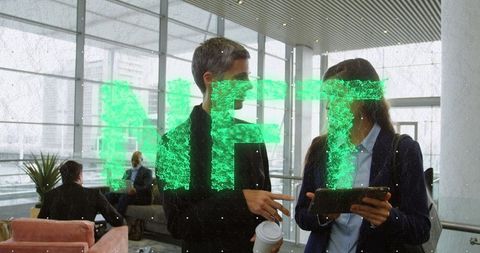 Business professionals discussing nft technology in modern office